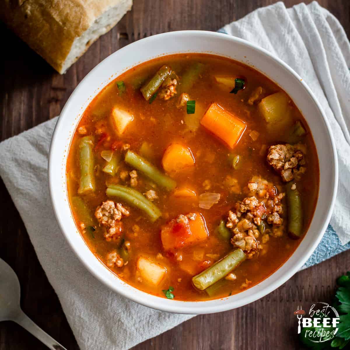 Instant Pot Hamburger soup served in a white bowl on a napkin