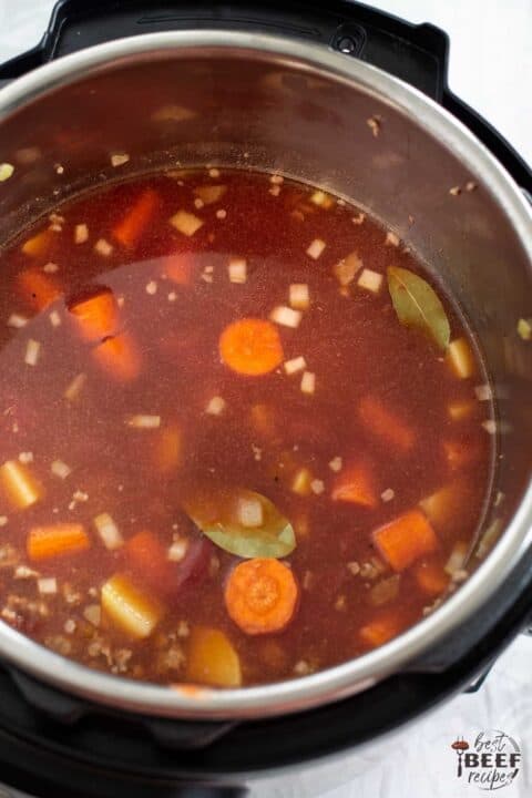 Instant pot hamburger soup in the pot ready to cook