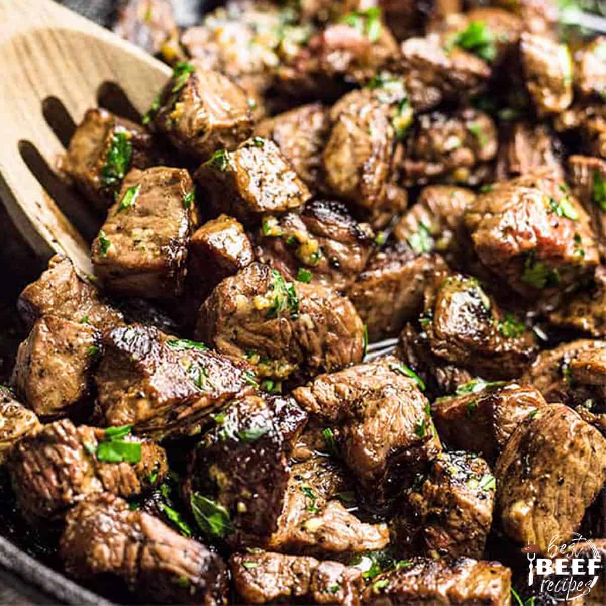 Close up of garlic butter steak bites in the skillet