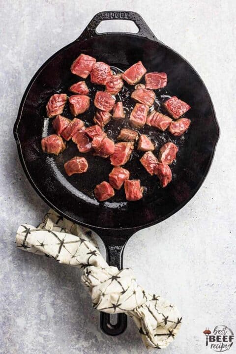 Cooking steak bites in a skillet - they are just starting to brown