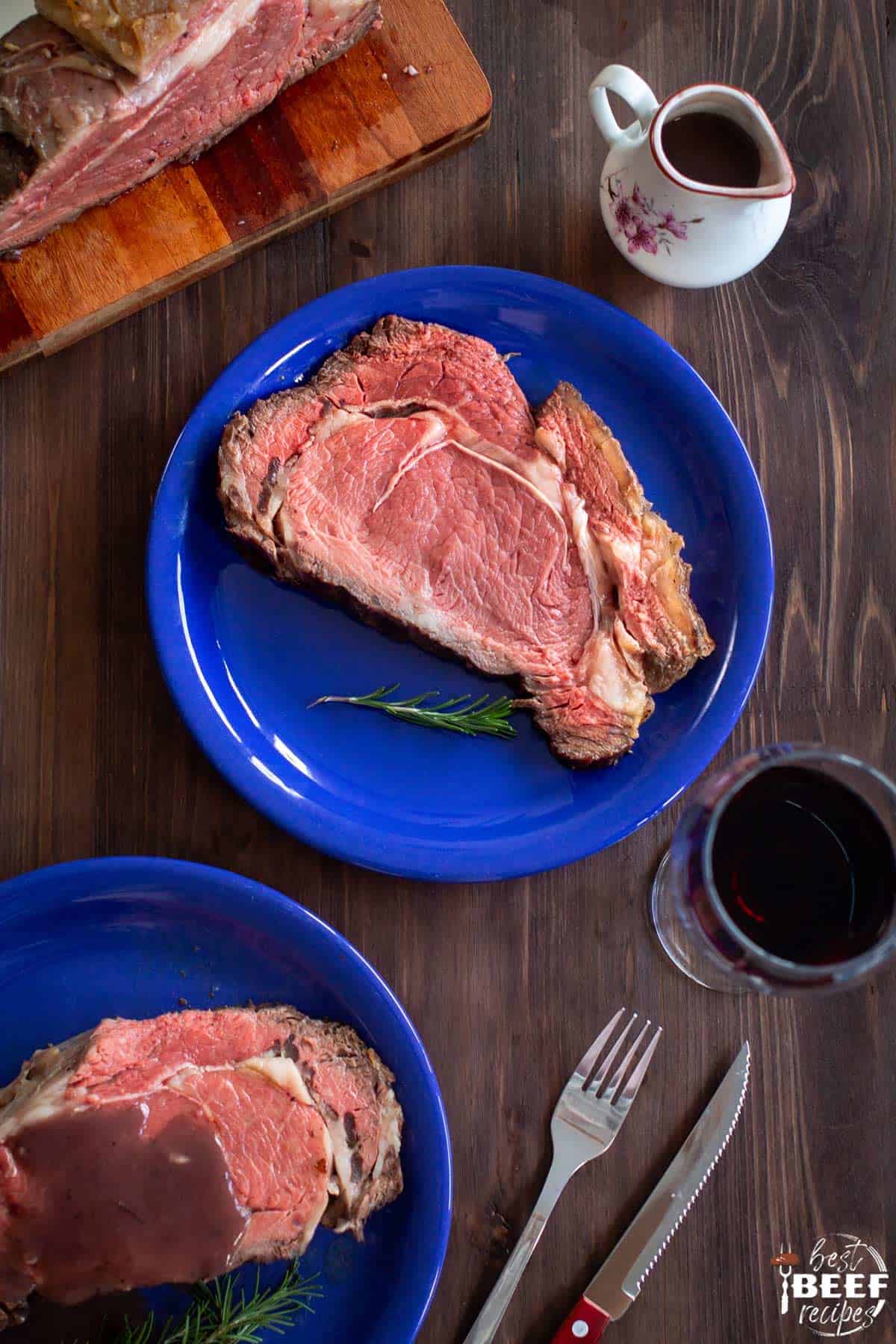 Two blue plates of instant pot prime rib