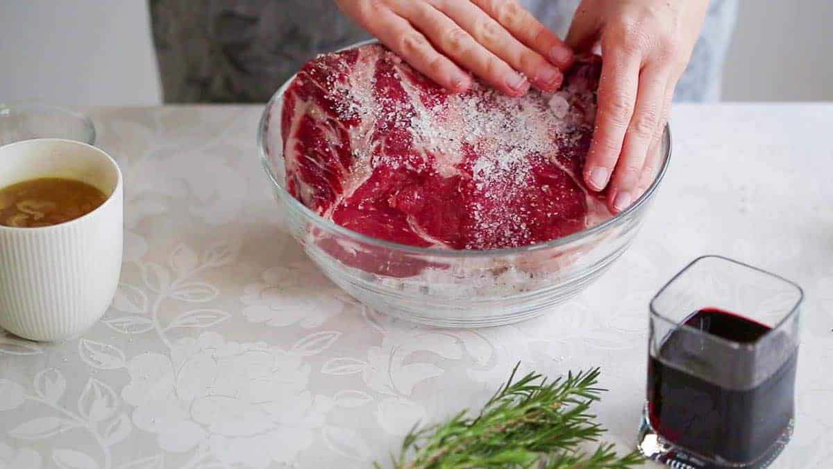 Patting salt onto prime rib