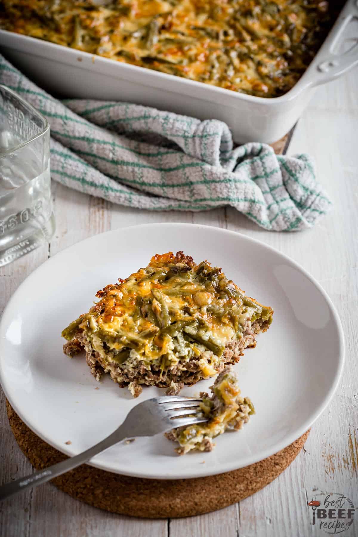 Keto cheeseburger casserole on a white plate with a fork