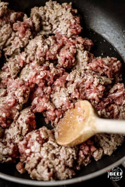 Browning the ground beef in a skillet