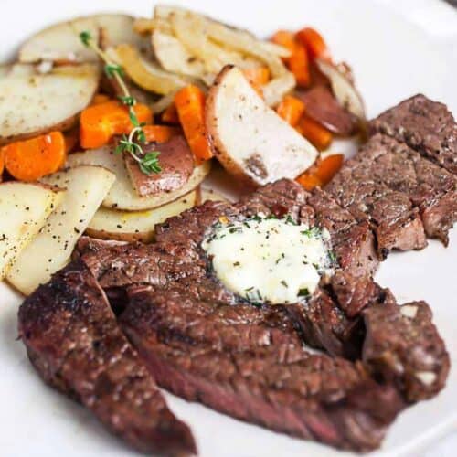 Chuck tender steak with compound butter and potatoes