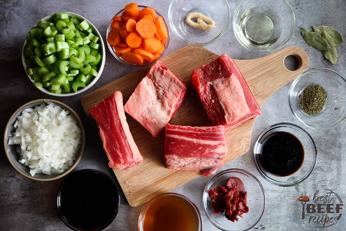 Ingredients to make slow cooker beef ribs on a grey surface