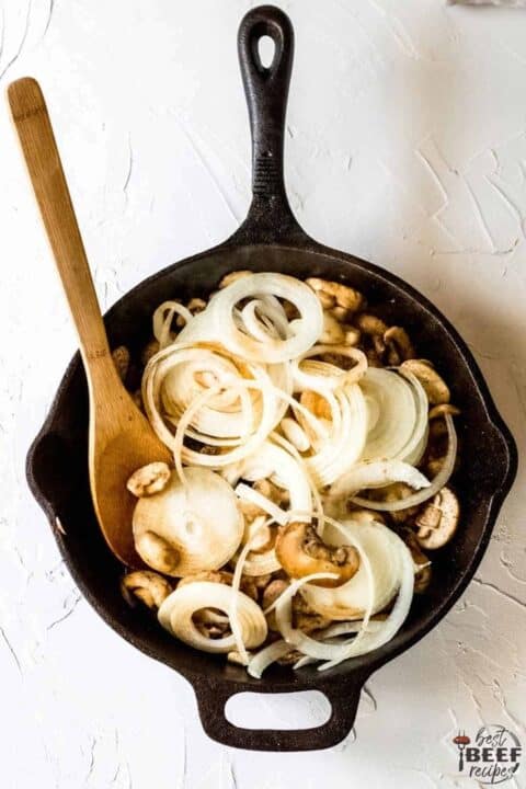 mushrooms and onions in a skillet
