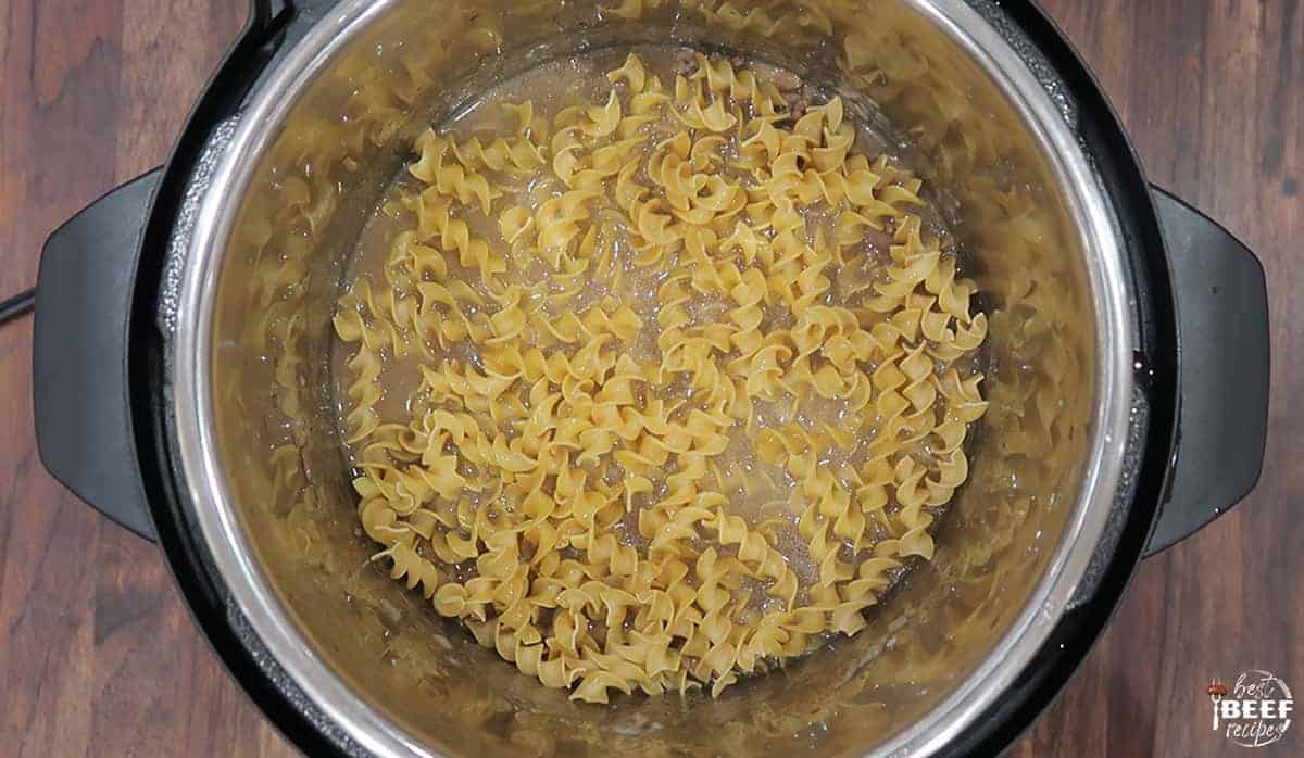 Egg noodles added to the instant pot beef and noodles