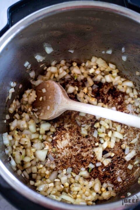 Onions and garlic cooking in instant pot