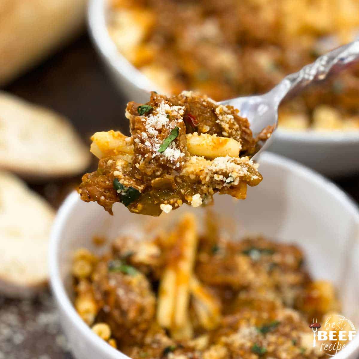 Instant pot steak pizzaiola on a spoon over a white bowl