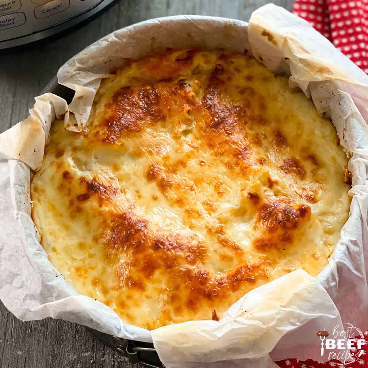 Instant pot beef lasagna in a parchment-lined springform pan