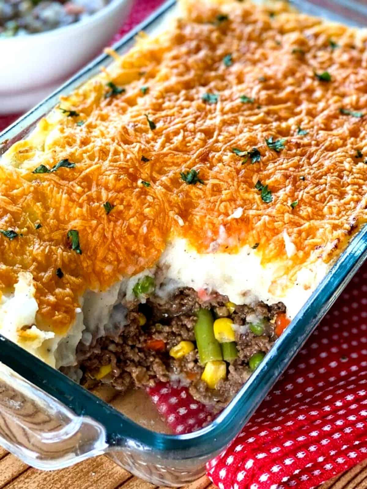 Instant Pot Shepherd's Pie in a casserole dish with a spoonful taken out