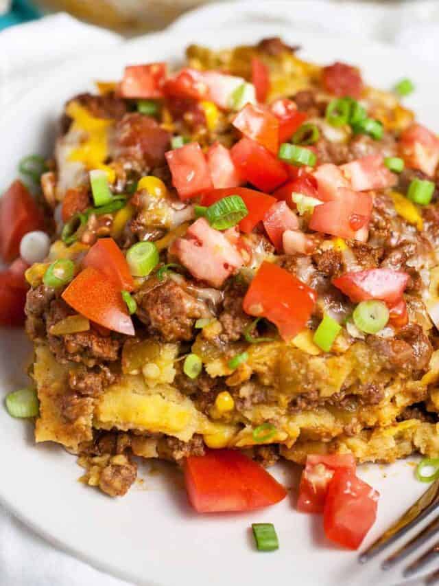 Mexican ground beef casserole on a plate with a fork