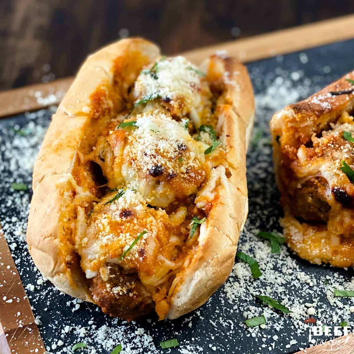 Baked meatball subs on a serving board