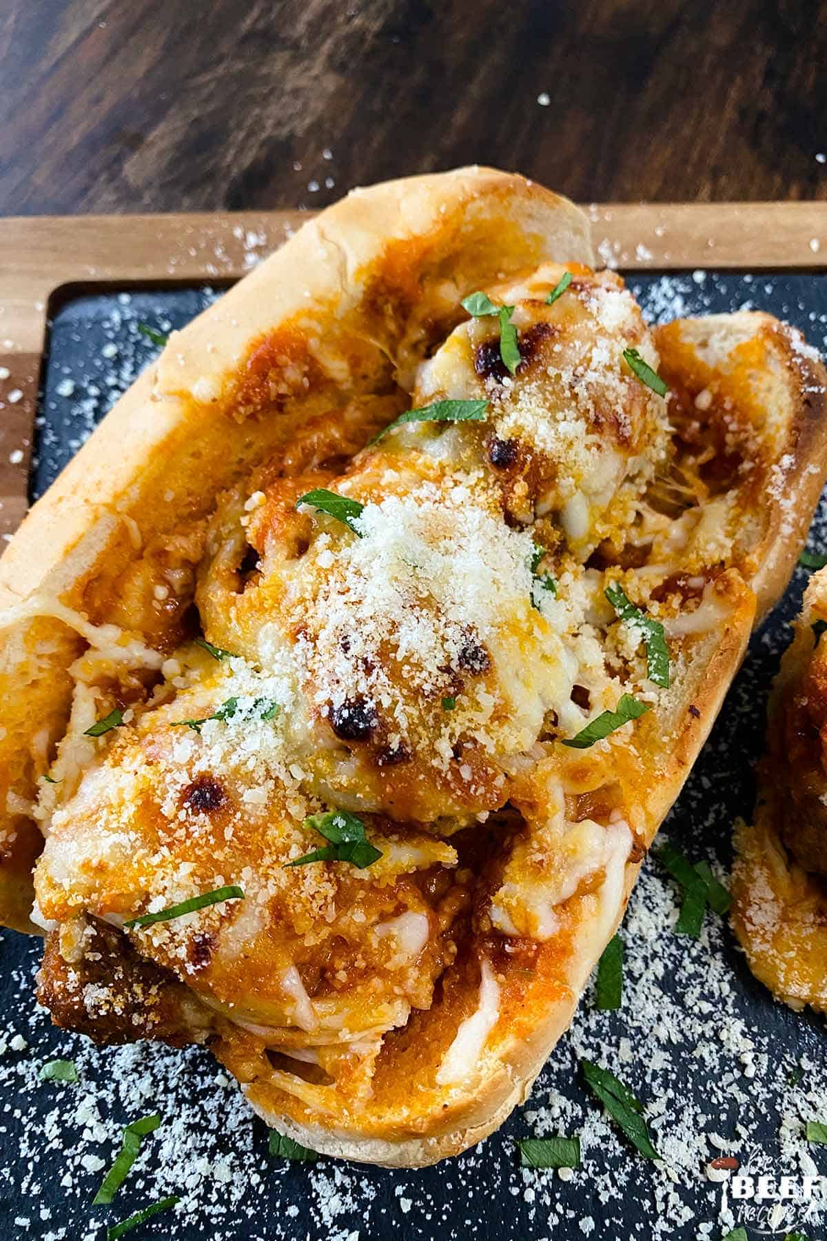 Meatball sandwich with baked cheese on top