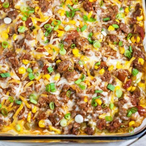 Close up Mexican ground beef casserole in glass dish