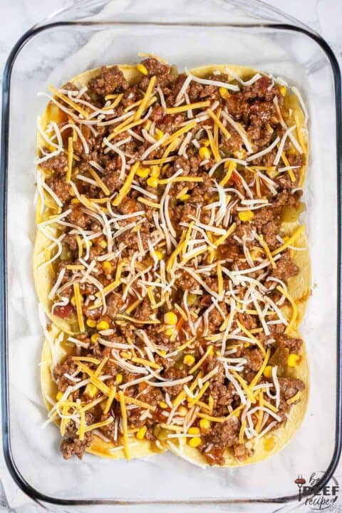 Ground beef mixture on top of tortillas with cheese