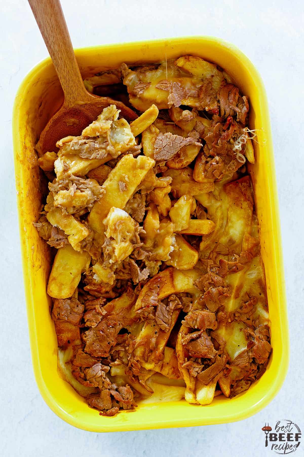 poutine in a yellow dish