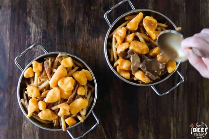 Pouring gravy over poutine fries and cheese curds