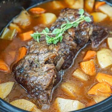 Slow cooker chuck roast in the crockpot with potatoes and carrots