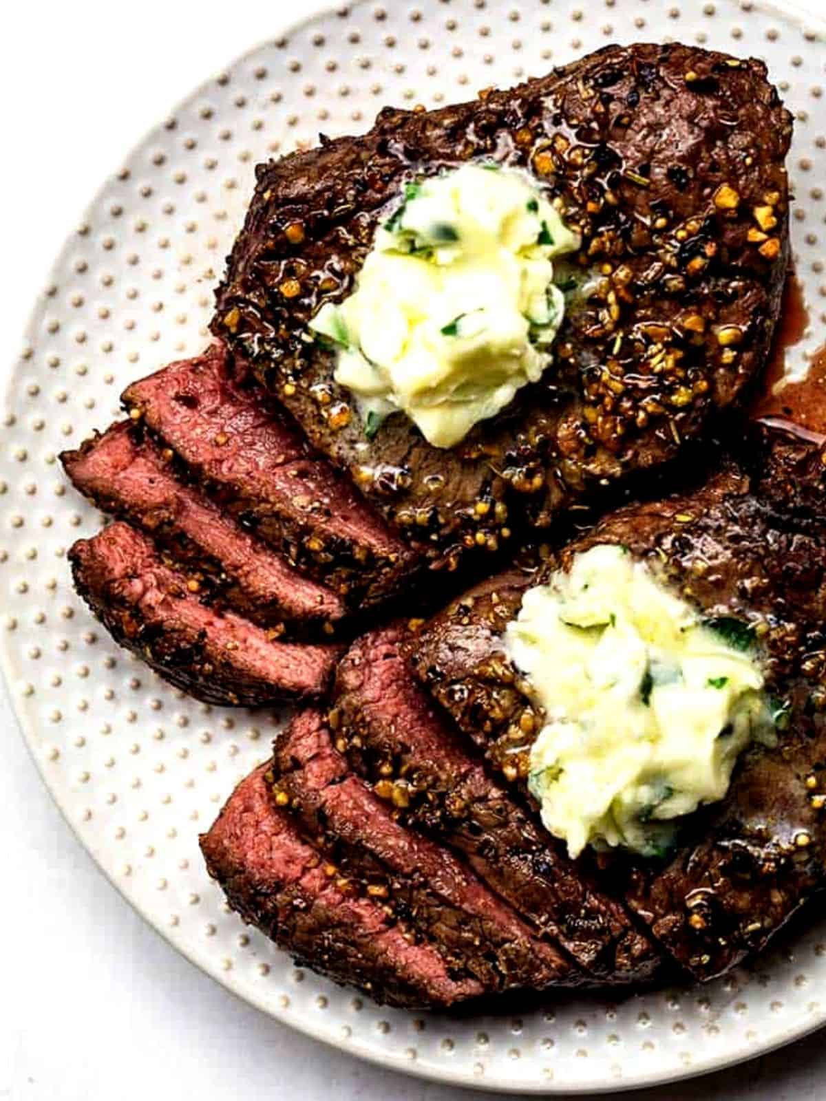 two air fryer steaks with garlic butter
