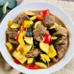 Vegetable beef stew in a white bowl