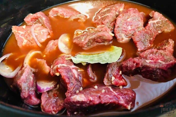 Stew beef in crockpot with bay leaf