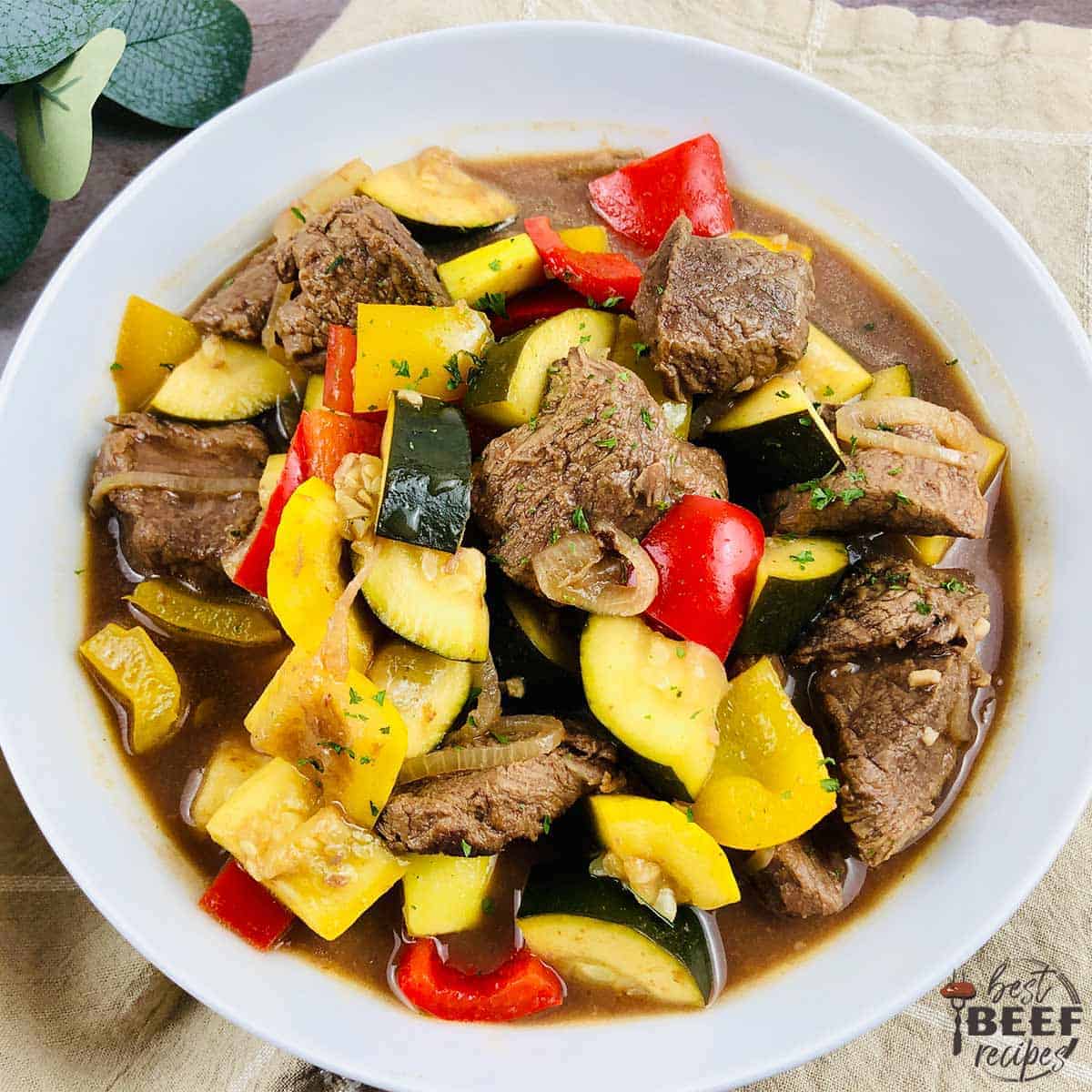 Vegetable beef stew in a white bowl