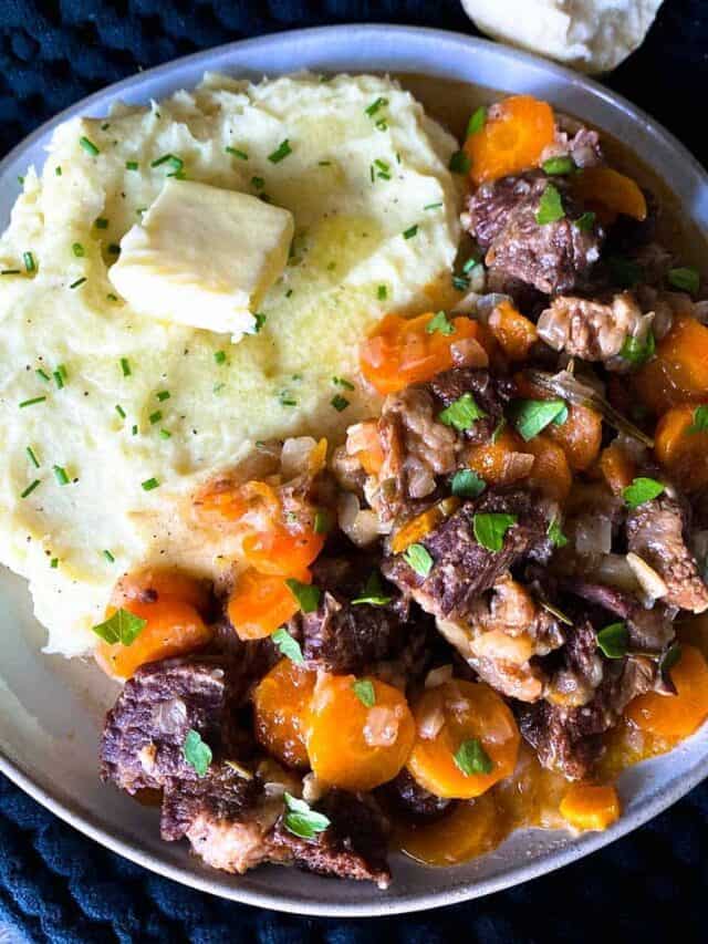 Instant pot beef short ribs on a plate with mashed potatoes