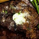 Overhead photo of rib eye steak with garlic butter for steak