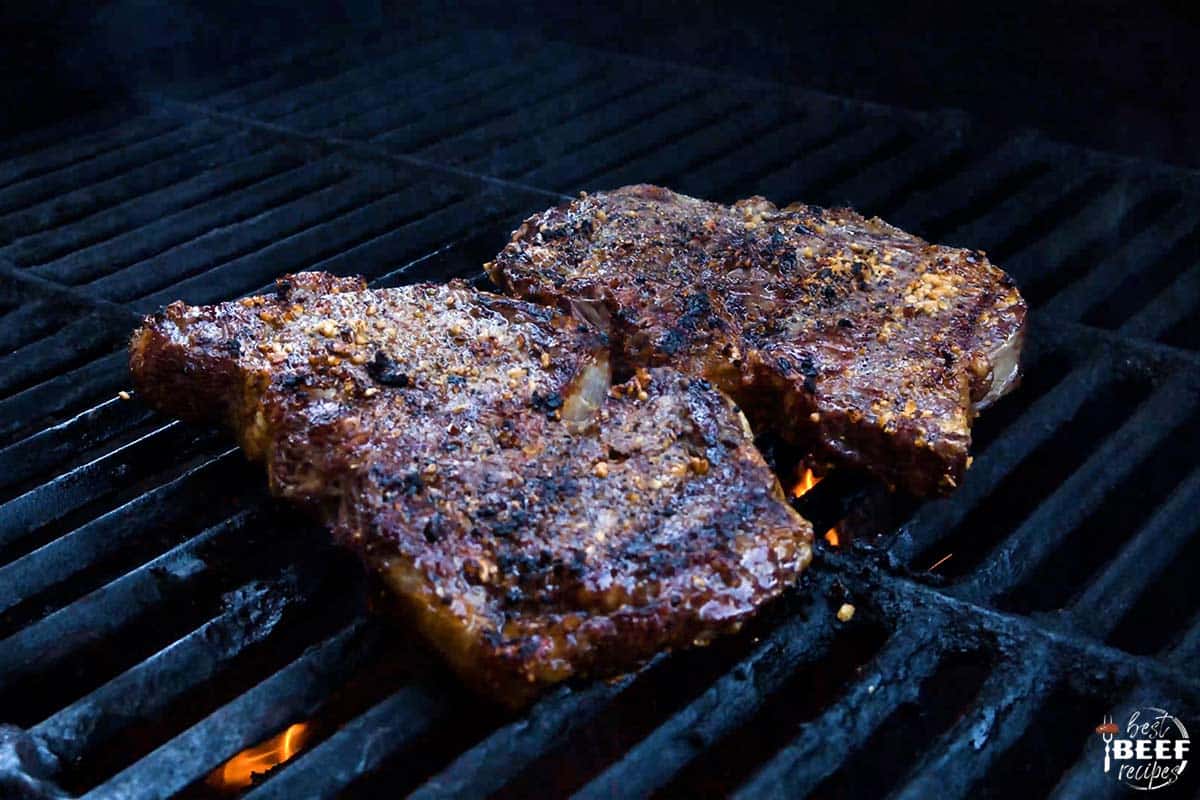 Two rib eye steaks on the grill