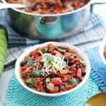 ground beef chili in a bowl and in a pot