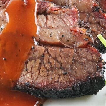 smoked brisket sliced with red gravy