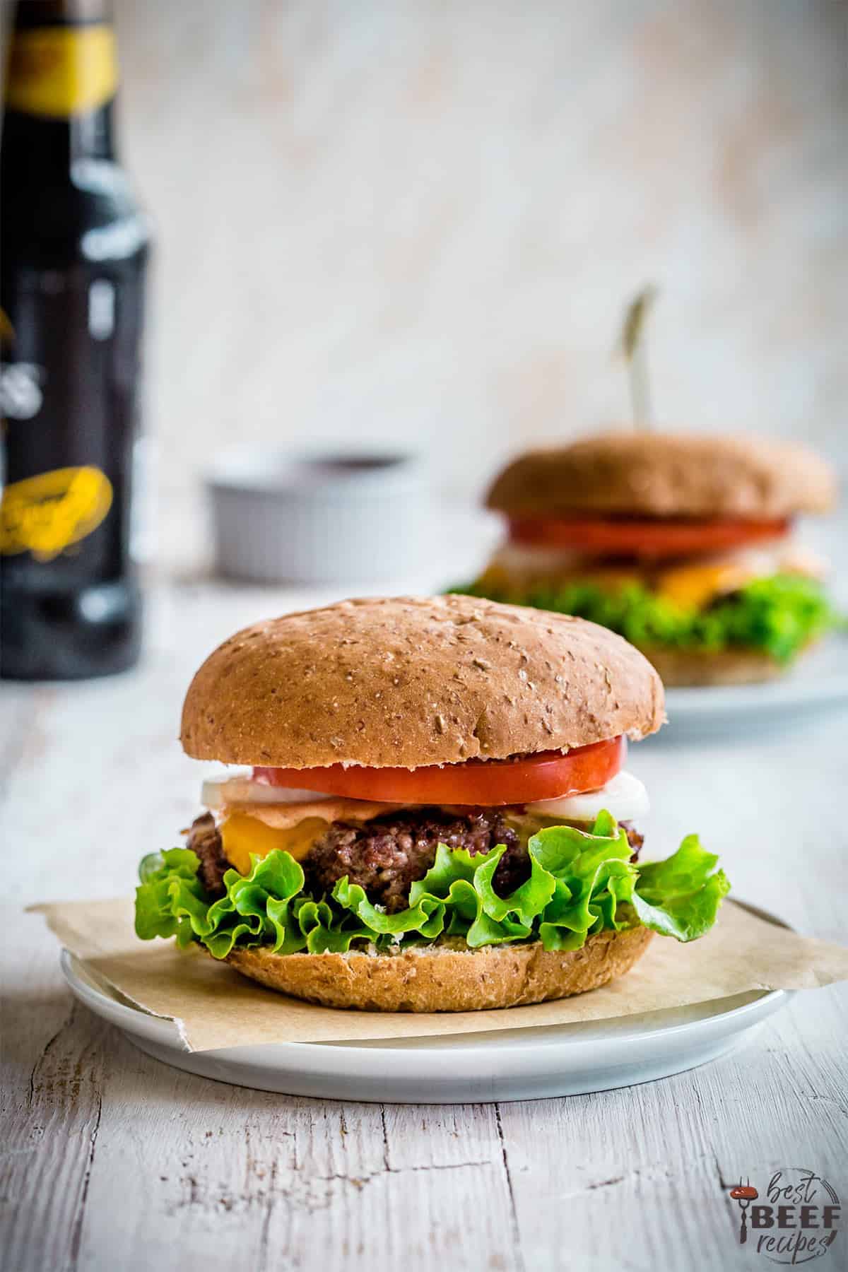 Two burgers on plates