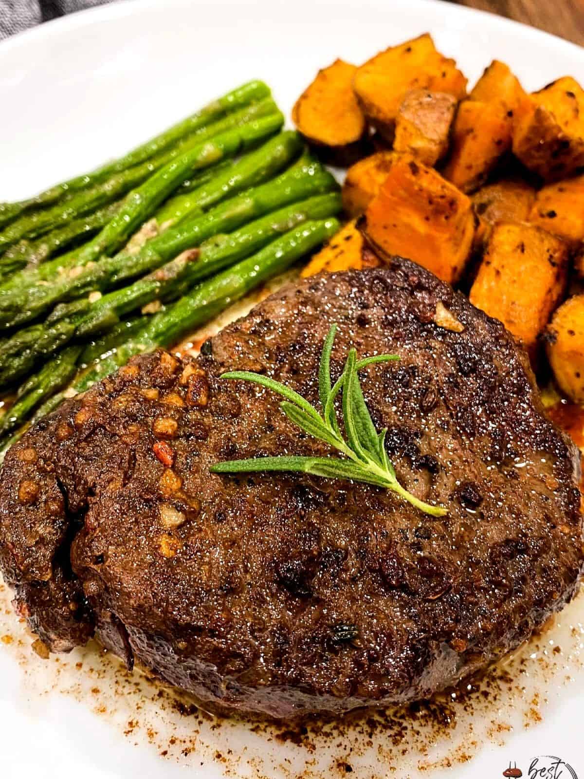 Filet mignon served with vegetables.