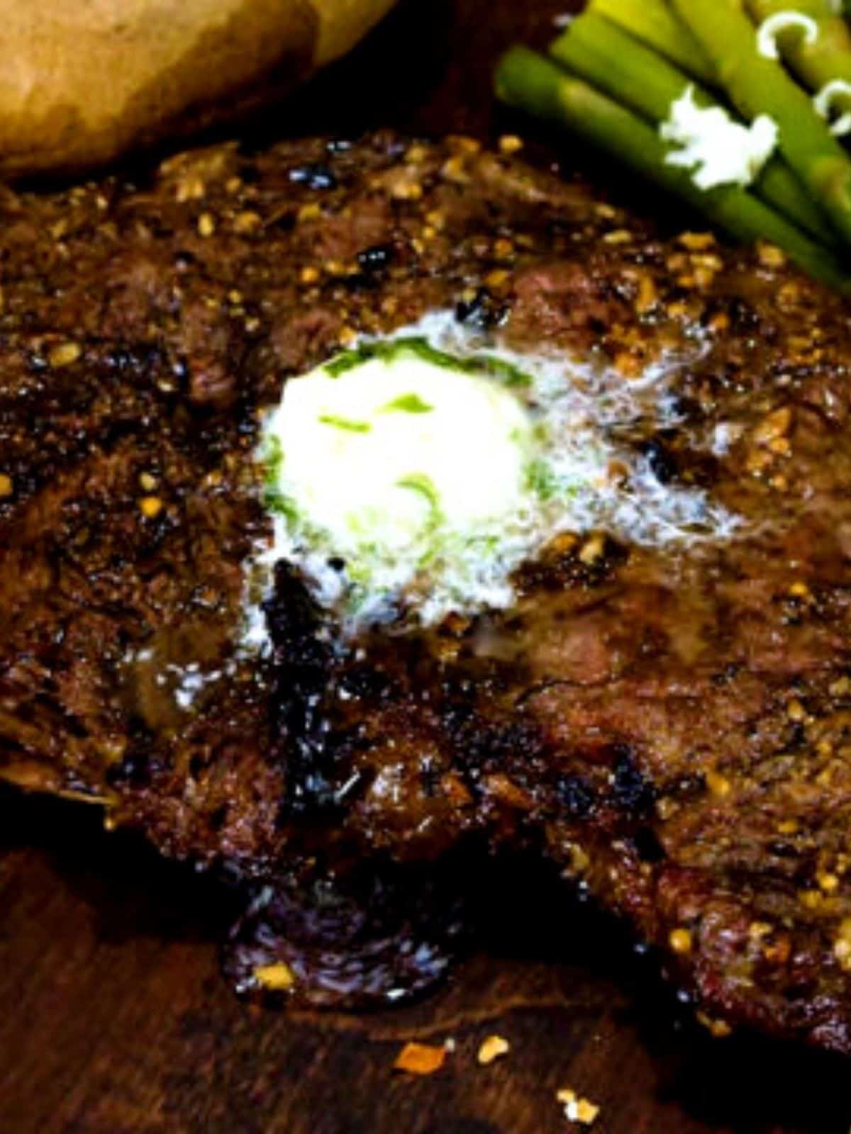 Grilled steak topped with garlic butter.