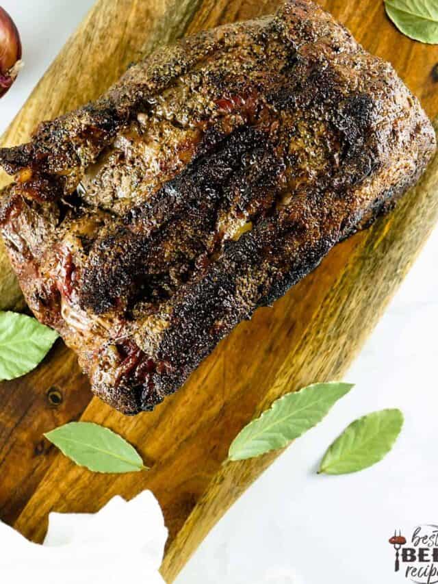 Whole smoked prime rib on a cutting board