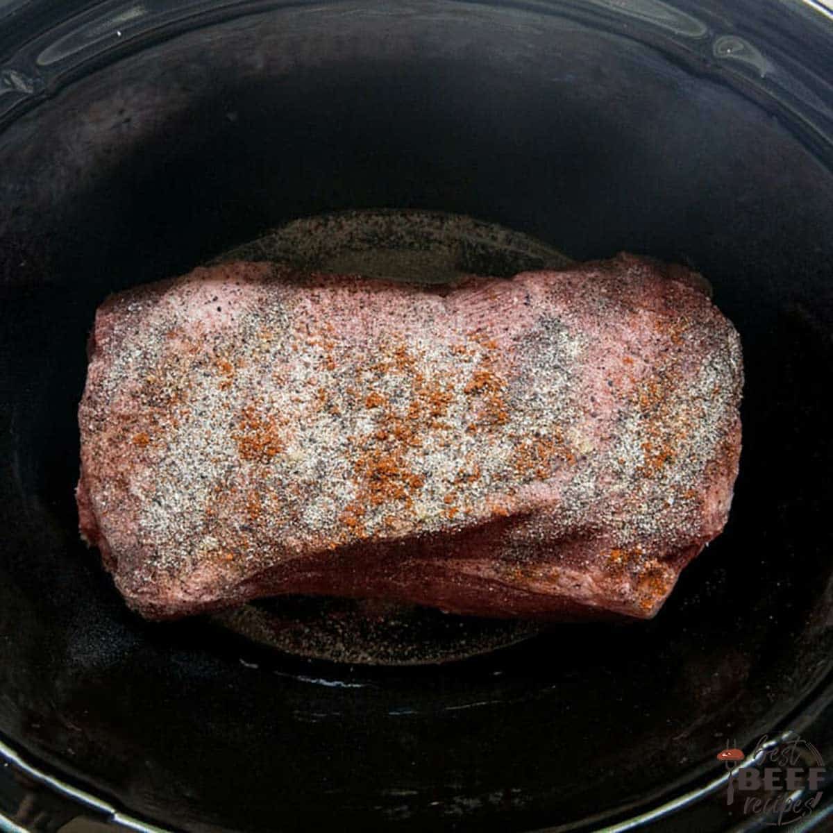 Seasoned beef brisket in slow cooker