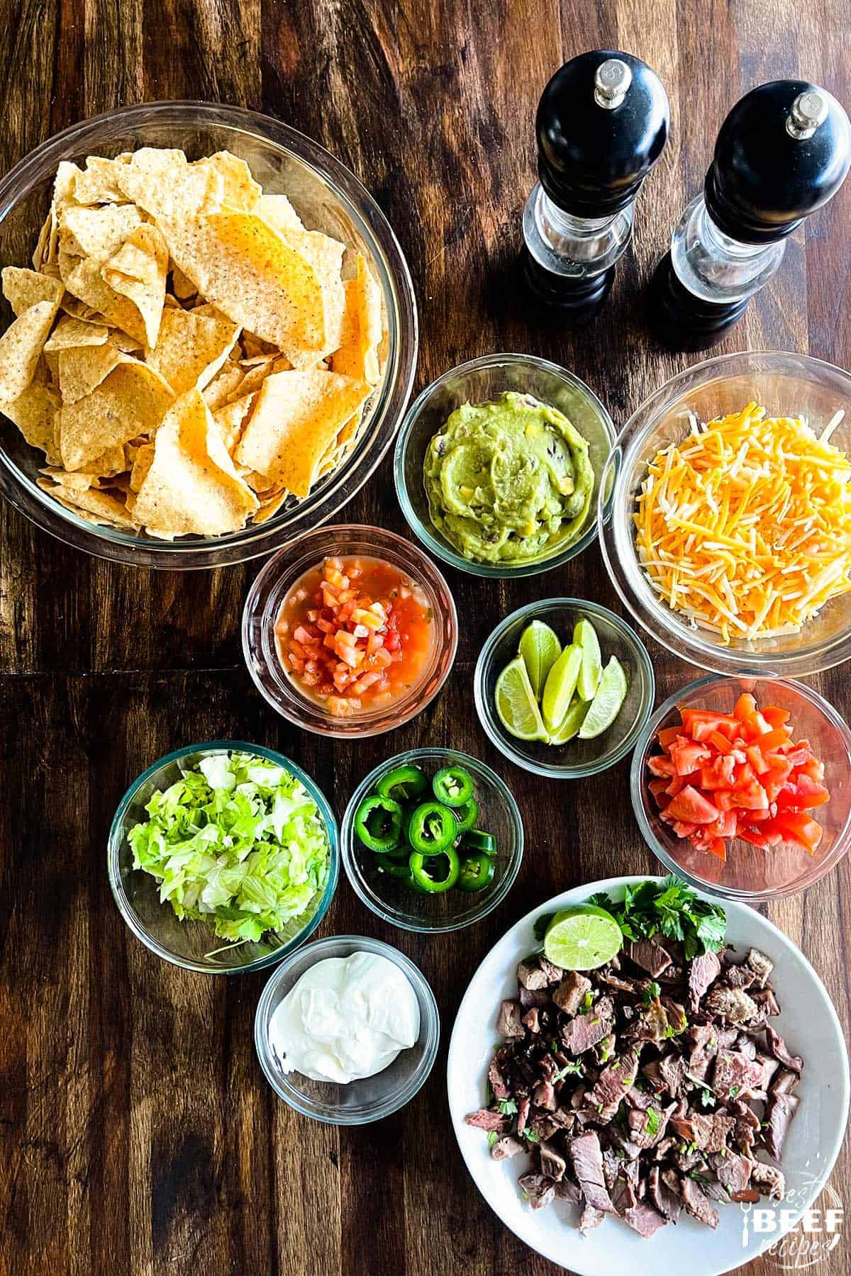 steak nachos ingredients on a table