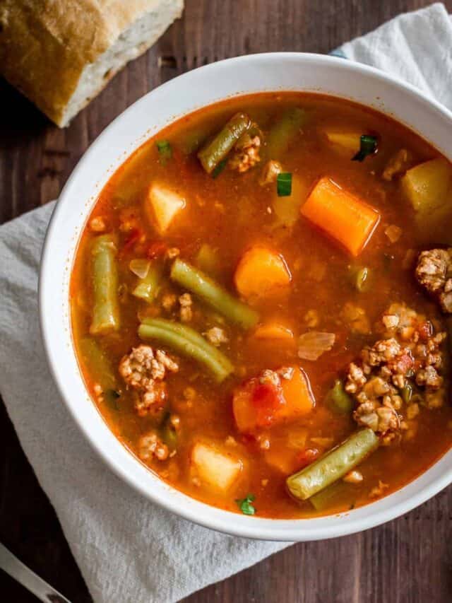 Hamburger soup with vegetables in a bowl.