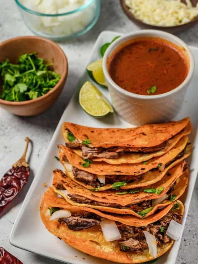 Birria tacos served with stew.
