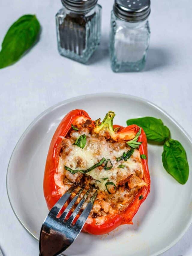 Stuffed bell pepper on a plate with a fork