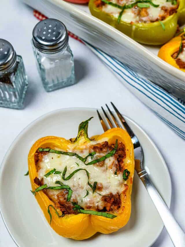 Stuffed bell pepper on a plate with a fork