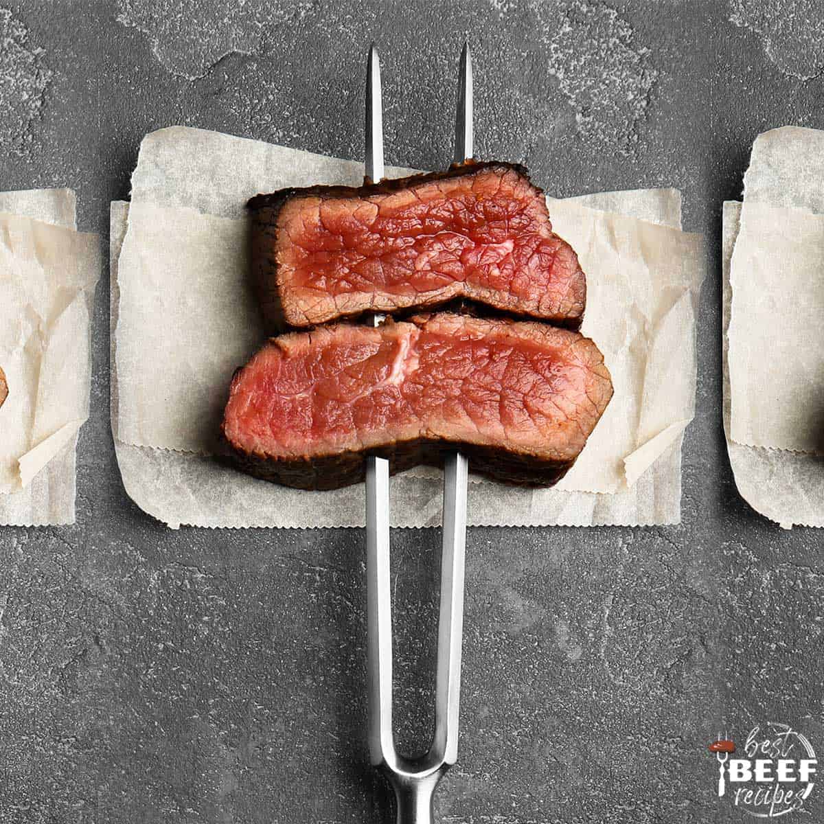 Medium rare steak on a beef fork