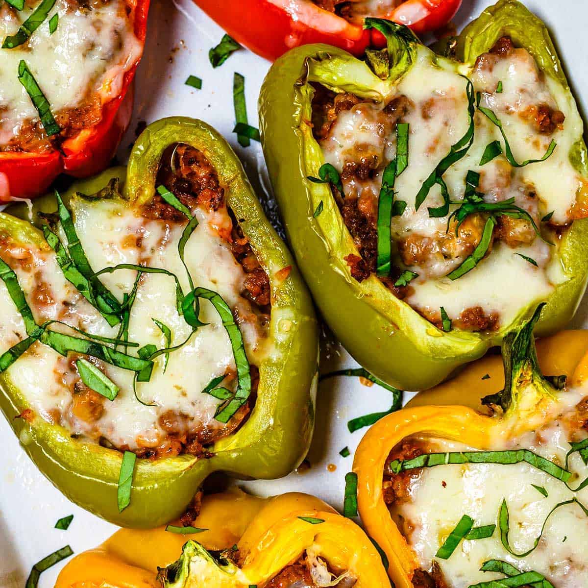 Six stuffed bell peppers up close