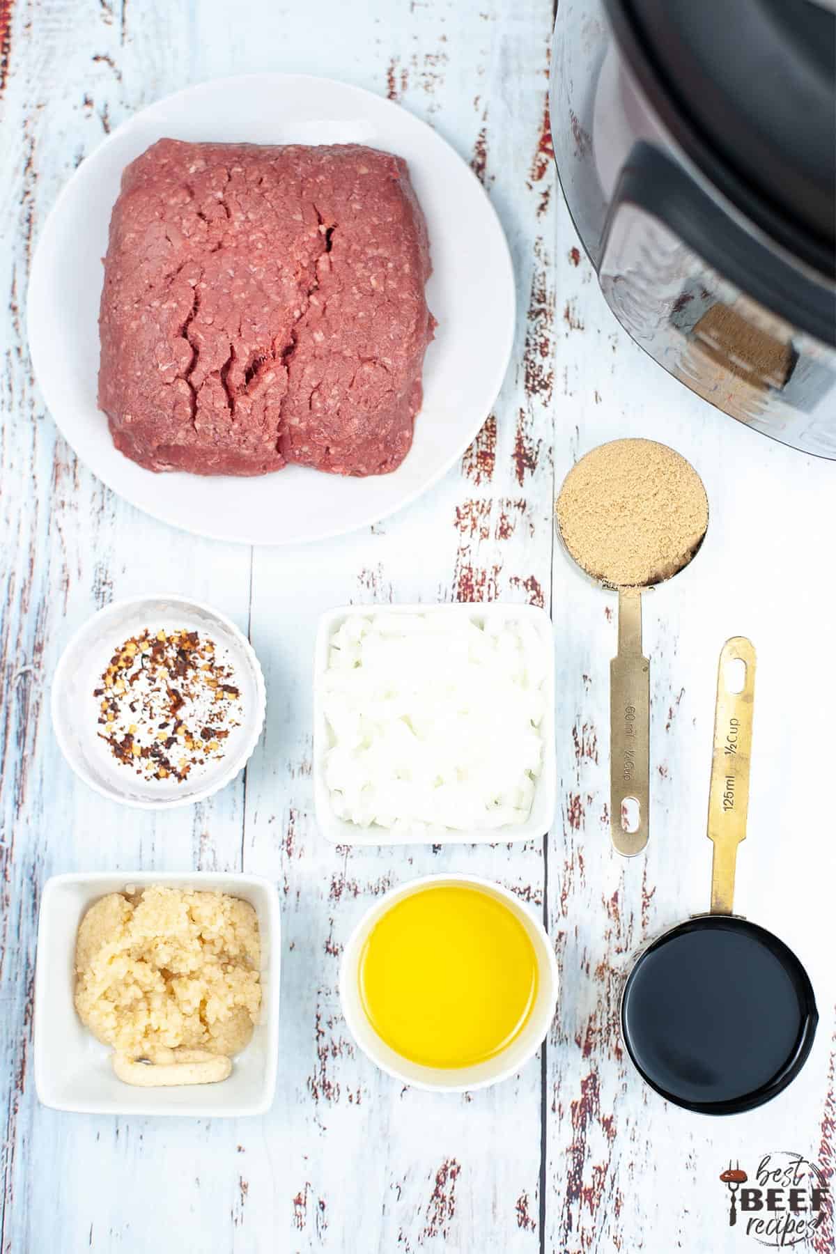 Ingredients to make Korean ground beef on a white table