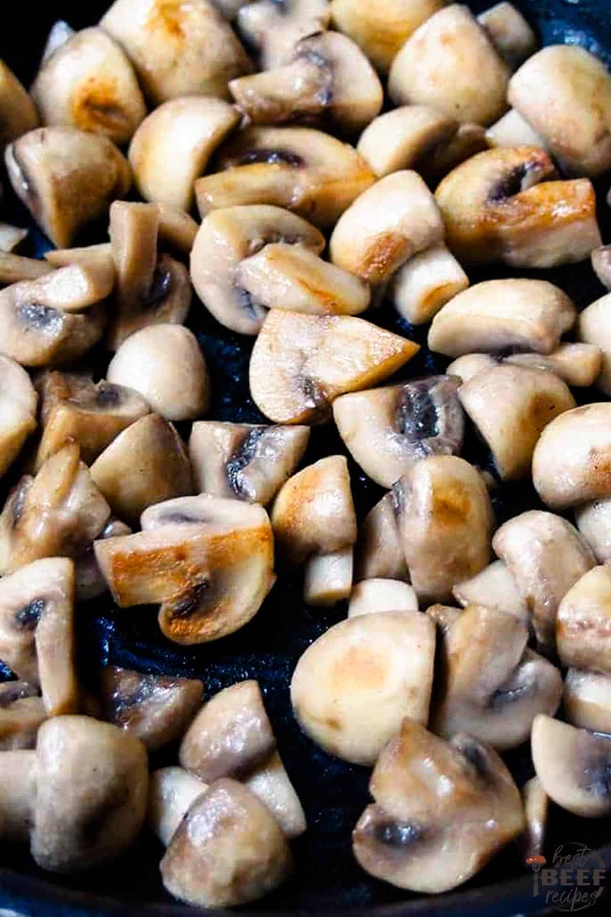 Mushrooms cooking in a pan