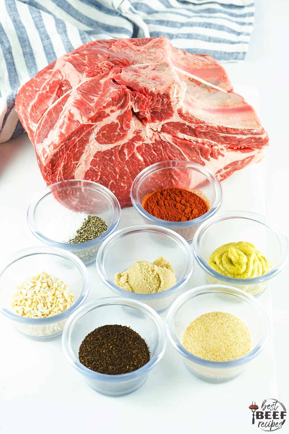 ingredients for prime rib roast on a white surface