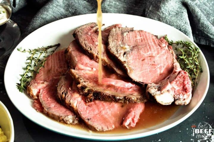 Au jus dripping over sliced prime rib
