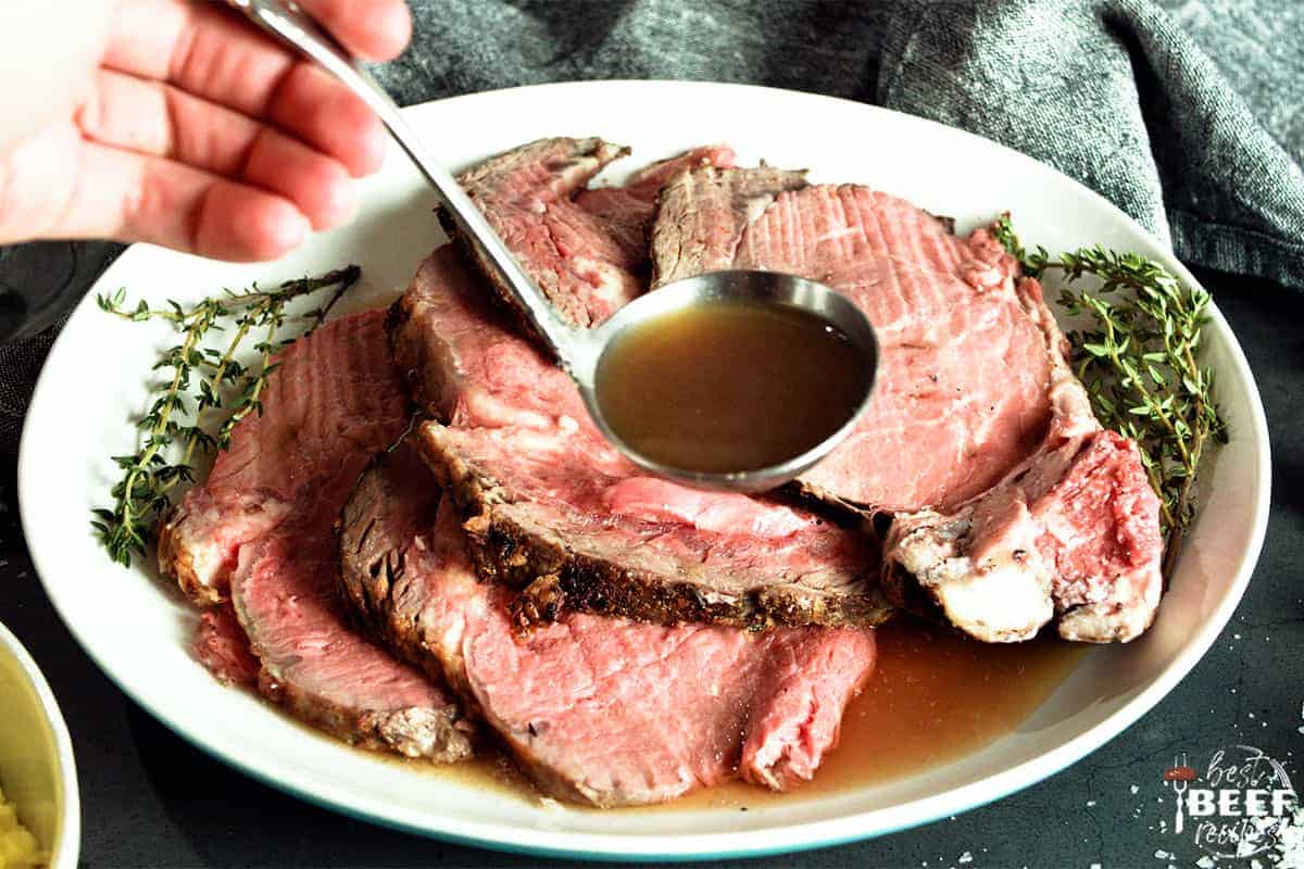 Pouring au jus over prime rib